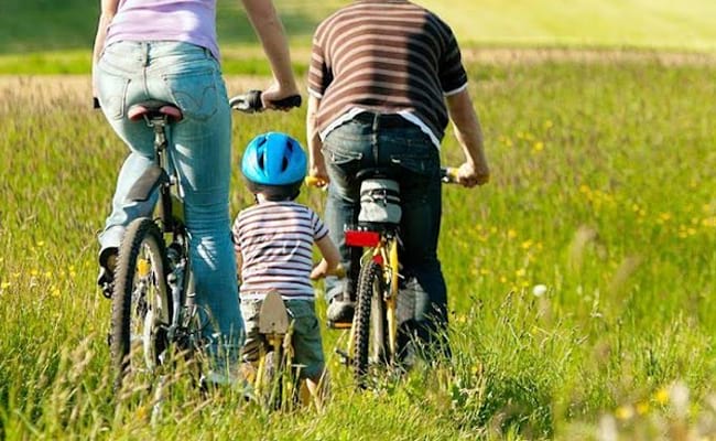 family and toddler cycling 